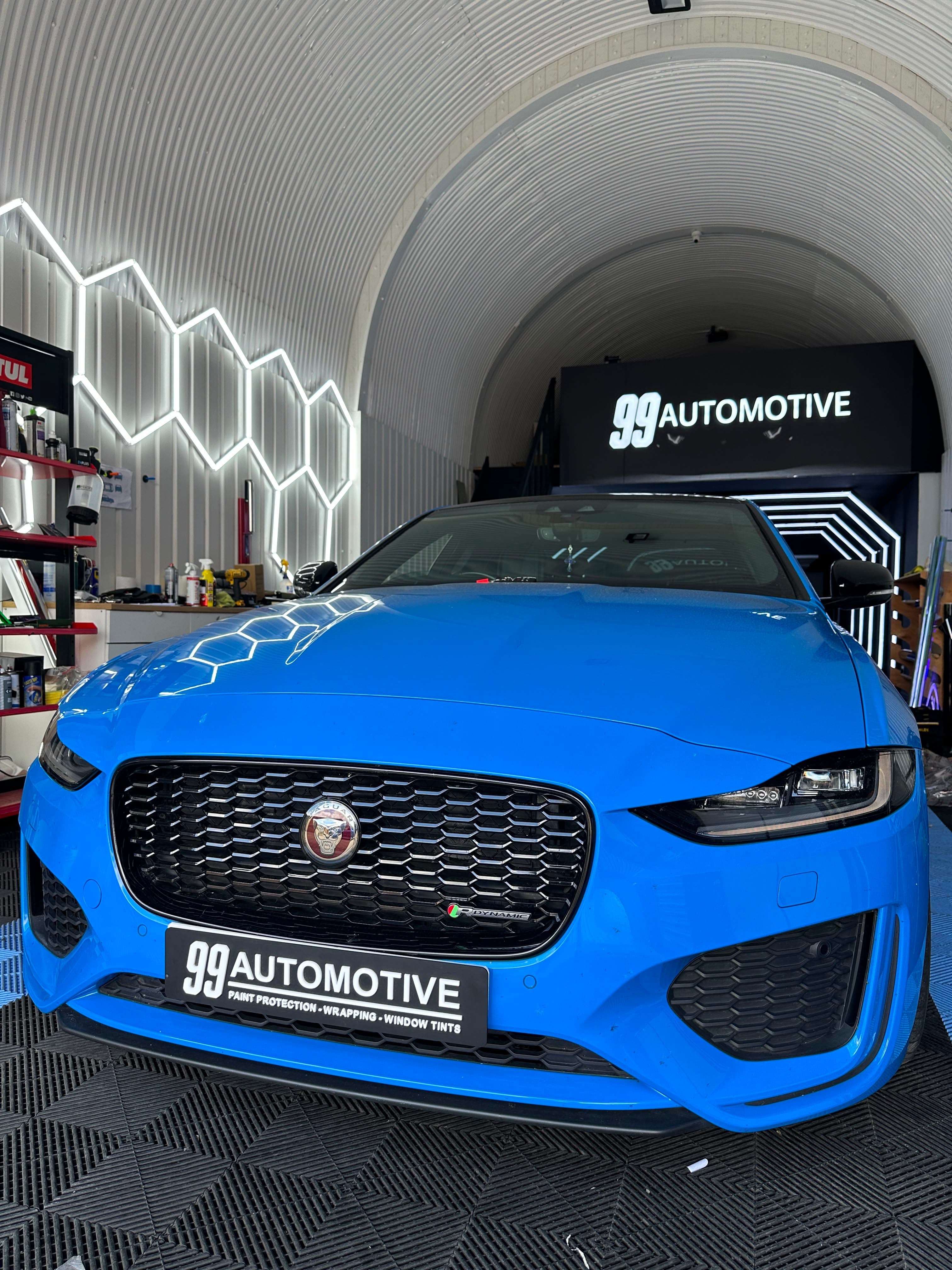 Blue Jaguar F-Type under the arched wrap ceiling