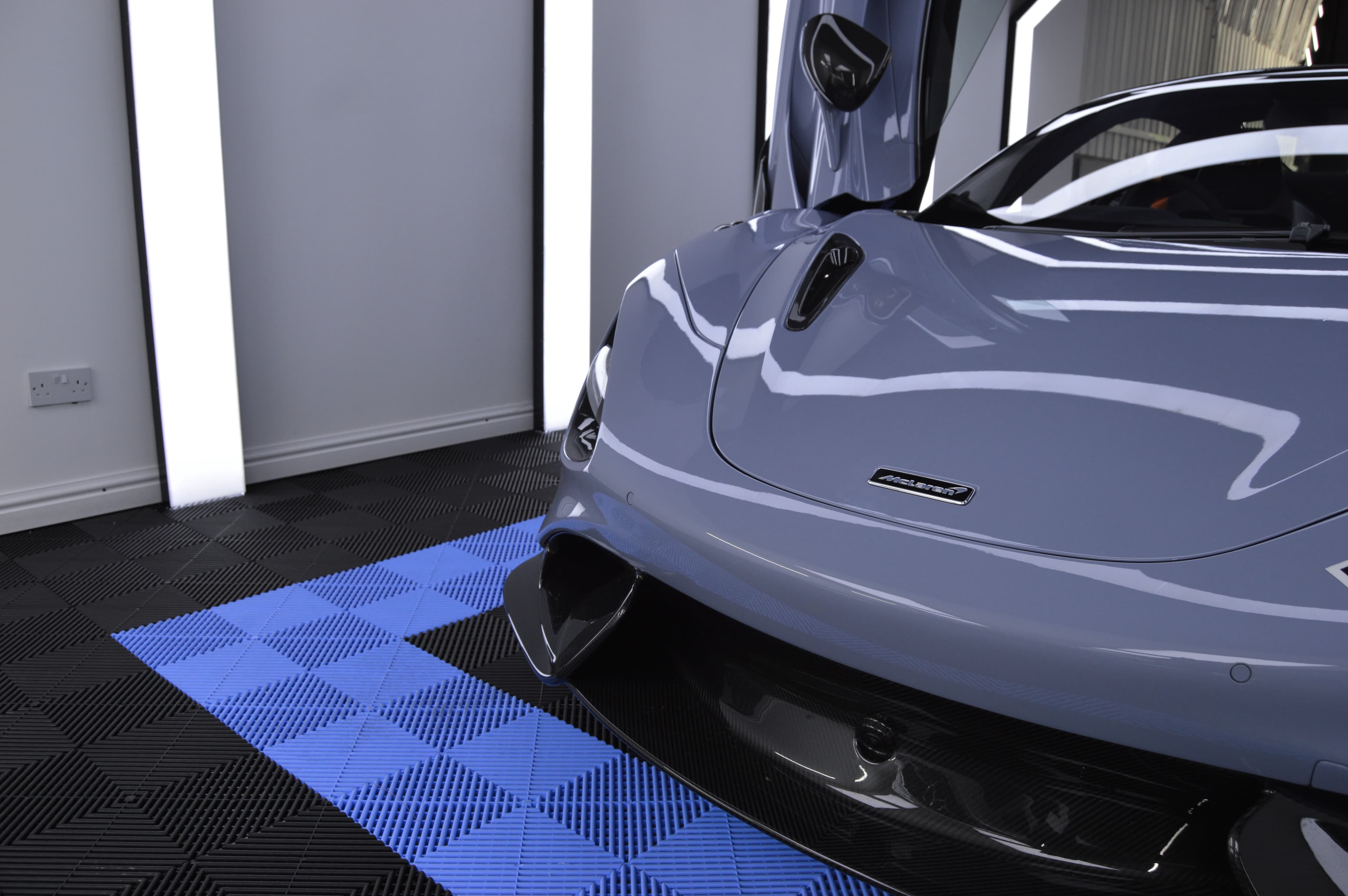 McLaren nose, carbon splitter, dihedral door open